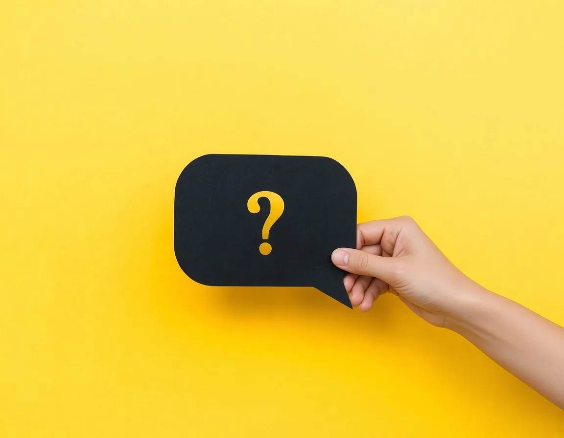 Person holding a question mark, representing common trademark registration questions